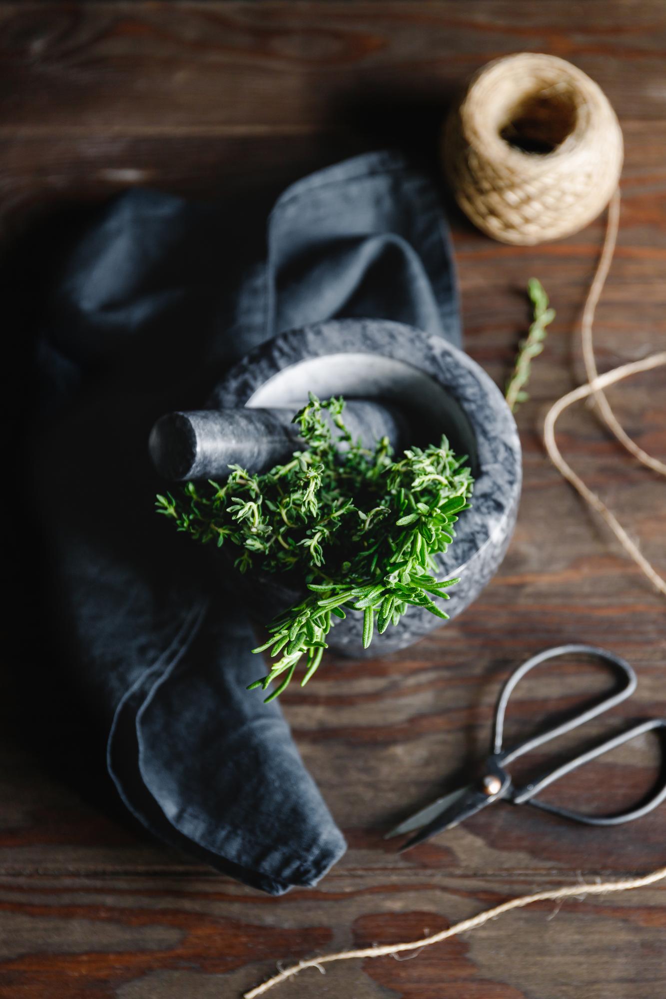 Close-up herbs and tools on table