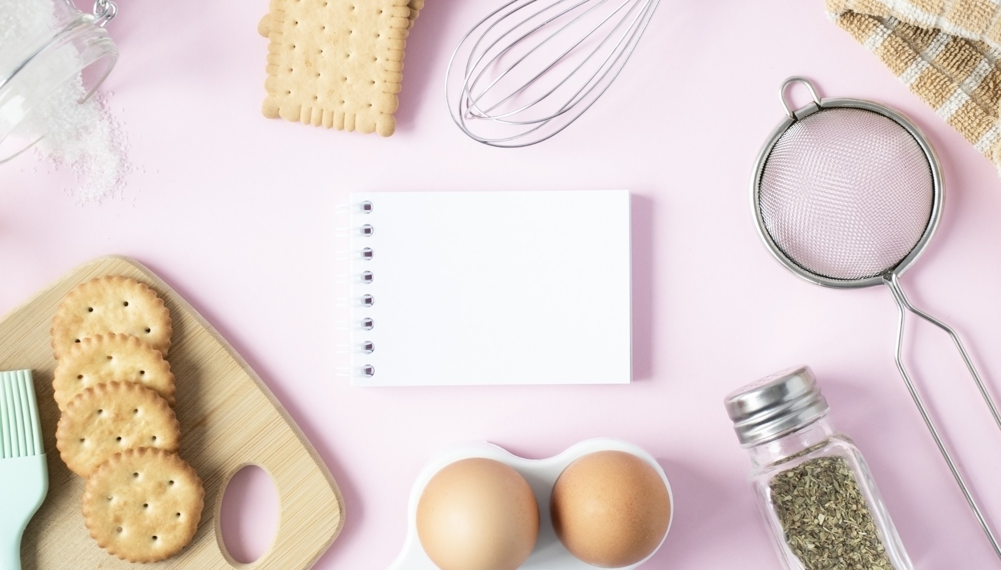 Flat lay of cooking tools and recipe notes